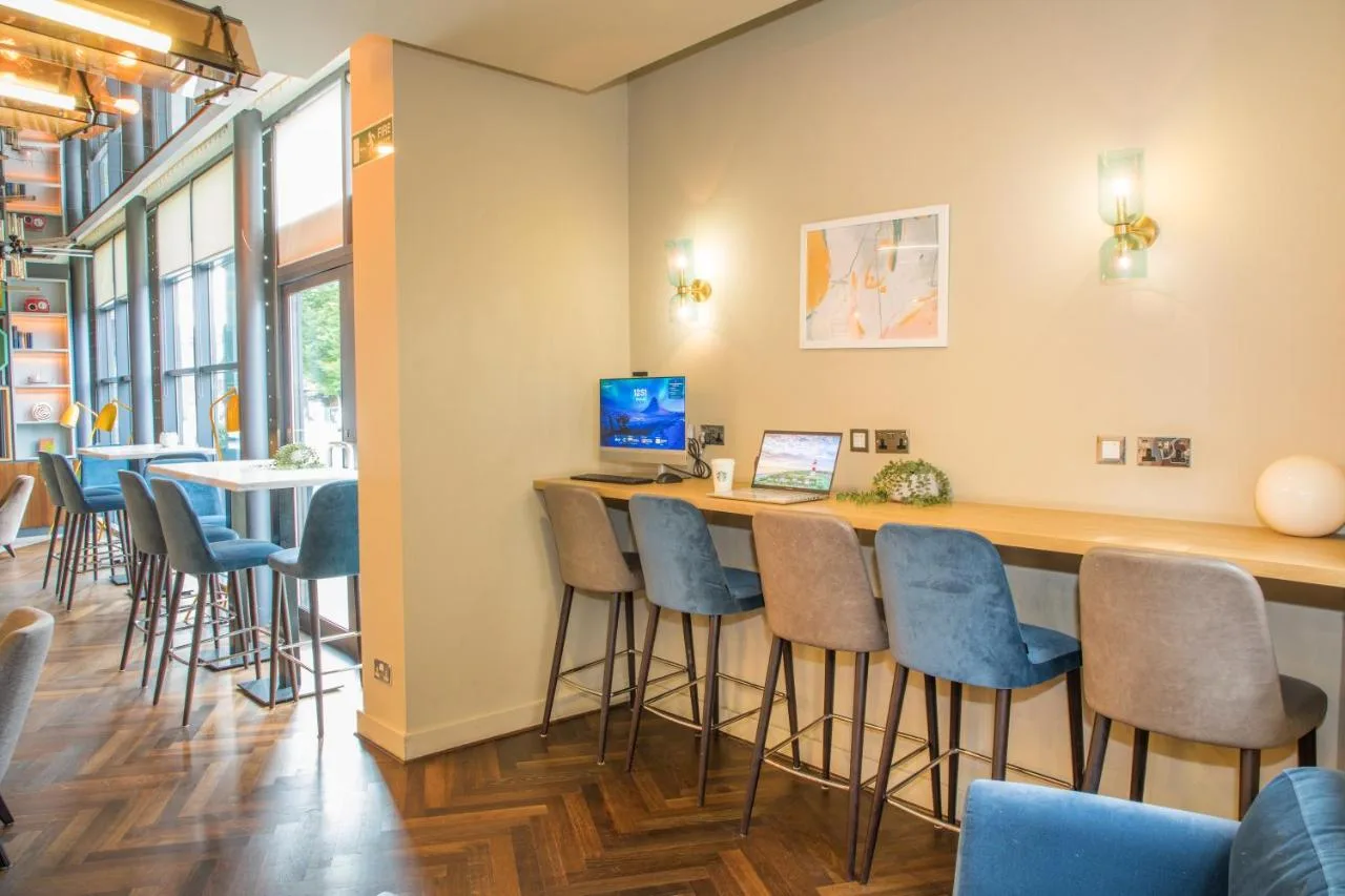 Cocktail bar with blue bar stools at Holiday Inn York City Centre by IHG on Piccadilly, York