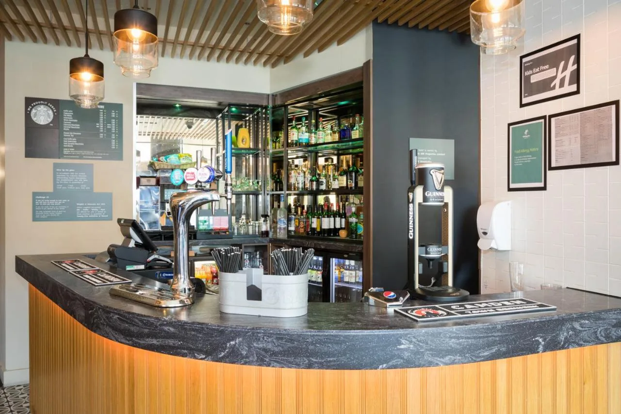 Bar counter with drinks at Holiday Inn York City Centre by IHG, York City Centre