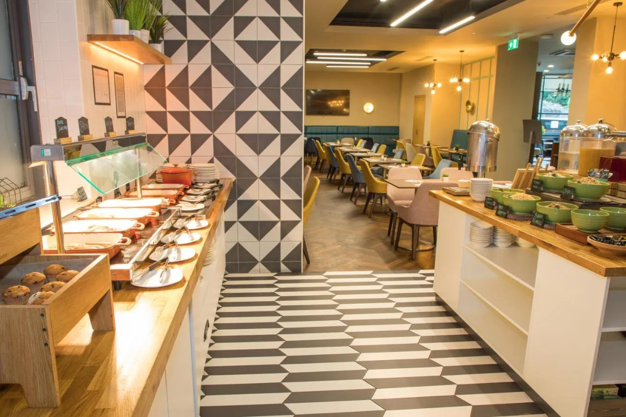 Dining area with checkered floor at Holiday Inn York City Centre by IHG, York